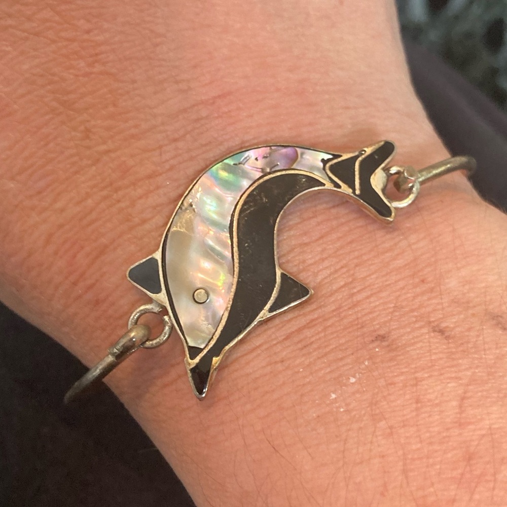 Sterling, onyx, and mother of pearl dolphin bangle
